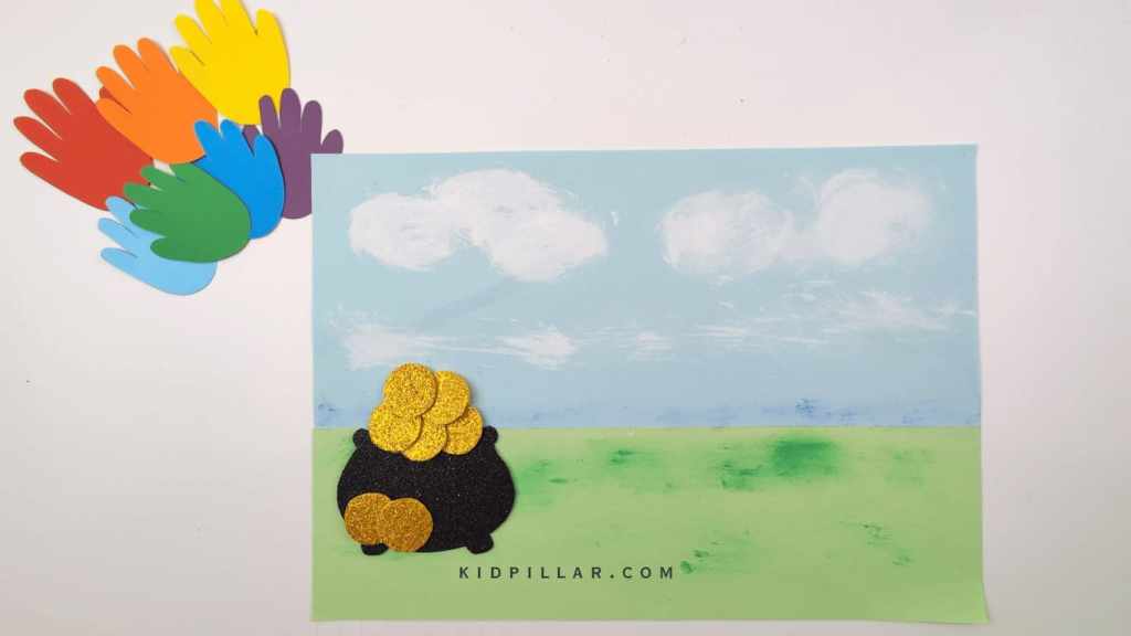 Paste the pot of gold craft on the painted background